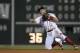 Boston Red Sox's Ian Kinsler throws to first base on the ground out by Cleveland Indians' Yandy Diaz during the fifth inning of a baseball game in Boston, Tuesday, Aug. 21, 2018. (AP Photo/Michael Dwyer)