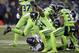 FILE - In this Monday, Dec. 10, 2018, file photo, Seattle Seahawks' Bobby Wagner (54) raises his fist after stopping Minnesota Vikings' Latavius Murray on a fourth down run in the second half of an NFL football game in Seattle. Wagner, making a hefty statement for NFL Defensive Player of the Year, seeks his eighth straight game with at least eight tackles. (AP Photo/Stephen Brashear, File)
