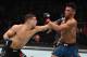 MILWAUKEE, WISCONSIN - DECEMBER 15: (L-R) Al Iaquinta punches Kevin Lee in their lightweight bout during the UFC Fight Night event at Fiserv Forum on December 15, 2018 in Milwaukee, Wisconsin. (Photo by Jeff Bottari/Zuffa LLC/Zuffa LLC via Getty Images)