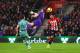 SOUTHAMPTON, ENGLAND - DECEMBER 16: Charlie Austin of Southampton scores his team's third goal as Bernd Leno of Arsenal reaches for the ball during the Premier League match between Southampton FC and Arsenal FC at St Mary's Stadium on December 16, 2018 in Southampton, United Kingdom. (Photo by Clive Rose/Getty Images)