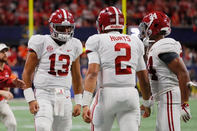 ATLANTA, GA - DECEMBER 01:  Jalen Hurts #2 of the Alabama Crimson Tide celebrates with Tua Tagovailoa #13 on the sideline after rushing for a 15-yard touchdown in the fourth quarter against the Georgia Bulldogs during the 2018 SEC Championship Game at Mercedes-Benz Stadium on December 1, 2018 in Atlanta, Georgia.  (Photo by Kevin C. Cox/Getty Images)