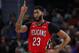 New Orleans Pelicans forward Anthony Davis signals against the Detroit Pistons in the second half of an NBA basketball game in Detroit, Sunday, Dec. 9, 2018. (AP Photo/Paul Sancya)