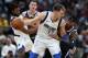 Denver Nuggets forward Torrey Craig, right, reaches in for the ball as Dallas Mavericks forward Luka Doncic looks for a shot in the second half of an NBA basketball game Tuesday, Dec. 18, 2018, in Denver. The Nuggets won 126-118. (AP Photo/David Zalubowski)