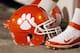FILE - In this Dec. 3, 2011, file photo, a Clemson football helmet rests on the sidelines during the second half of an NCAA college football game against Virginia Tech in Charlotte, N.C. John Antonio, the man who designed Clemson's tiger paw logo, died Thursday, May 30, 2013, in Greenville, S.C., after a long battle with cancer, the university said. He was 83. (AP Photo/Bob Leverone, File)