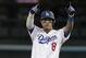 Los Angeles Dodgers' Manny Machado reacts after hitting a double during the first inning of Game 3 of the National League Championship Series baseball game Monday, Oct. 15, 2018, in Los Angeles. (AP Photo/Jae Hong)