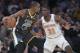 New York Knicks guard Damyean Dotson (21) guards Golden State Warriors forward Kevin Durant (35) during the second half of an NBA basketball game, Friday, Oct. 26, 2018, at Madison Square Garden in New York. The Warrior won 128-100. (AP Photo/Mary Altaffer)