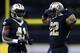 NEW ORLEANS, LA - JANUARY 07: Mark Ingram #22 of the New Orleans Saints and Alvin Kamara #41 react during the NFC Wild Card playoff game against the Carolina Panthers at the Mercedes-Benz Superdome on January 7, 2018 in New Orleans, Louisiana. (Photo by Jonathan Bachman/Getty Images)