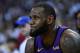 OAKLAND, CA - DECEMBER 25: LeBron James #23 of the Los Angeles Lakers looks on from the bench after he was hurt against the Golden State Warriors during the second half of their NBA Basketball game at ORACLE Arena on December 25, 2018 in Oakland, California. NOTE TO USER: User expressly acknowledges and agrees that, by downloading and or using this photograph, User is consenting to the terms and conditions of the Getty Images License Agreement. (Photo by Thearon W. Henderson/Getty Images)