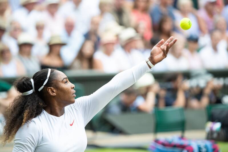 LONDON - ENGLAND JULY 14: Serena Williams of USA in action against Angelique Kerber of Germany (not pictured) in the Ladies Singles Final on center court during The Wimbledon Lawn Tennis Championship at the All England Lawn Tennis and Croquet Club at Wimbledon on July 14, 2018 in London, England. (Photo by Simon Bruty/Any Chance/Getty Images)