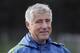 FILE - In this Oct. 27, 2015, file photo, then-Seattle Sounders head coach Sigi Schmid walks off the field following an MLS soccer training session, in Tukwila, Wash. Schmid, the winningest coach in Major League Soccer history who led the LA Galaxy to the first of five MLS Cup titles, has stepped down as coach of the Galaxy. The team said Schmid's resignation was effective immediately Monday, Sept. 10, 2018. Dominic Kinnear was named the interim head coach for the remainder of the season. (AP Photo/Ted S. Warren, File)