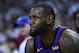OAKLAND, CA - DECEMBER 25: LeBron James #23 of the Los Angeles Lakers looks on from the bench after he was hurt against the Golden State Warriors during the second half of their NBA Basketball game at ORACLE Arena on December 25, 2018 in Oakland, California. NOTE TO USER: User expressly acknowledges and agrees that, by downloading and or using this photograph, User is consenting to the terms and conditions of the Getty Images License Agreement. (Photo by Thearon W. Henderson/Getty Images)