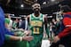 Boston Celtics' Kyrie Irving walks off the court after the Celtics defeated the Philadelphia 76ers 121-114 in overtime during an NBA basketball game in Boston, Tuesday, Dec. 25, 2018. (AP Photo/Michael Dwyer)