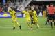 Columbus Crew SC midfielder Artur (8), Milton Valenzuela (19) and forward Federico Higuain (10) celebrate after penalty kicks in an MLS playoff soccer match against the D.C. United, Thursday, Nov. 1, 2018, in Washington. The Crew SC won 2-2 (3-2) in penalty kicks. (AP Photo/Nick Wass)