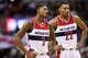 WASHINGTON, DC - NOVEMBER 26: Bradley Beal #3 and Otto Porter Jr. #22 of the Washington Wizards look on as the San Antonio Spurs shoot a technical foul shot in the second half at Verizon Center on November 26, 2016 in Washington, DC. NOTE TO USER: User expressly acknowledges and agrees that, by downloading and or using this photograph, User is consenting to the terms and conditions of the Getty Images License Agreement. (Photo by Rob Carr/Getty Images)
