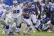 New York Giants' Saquon Barkley (26) runs the ball during the first half of an NFL football game against the Dallas Cowboys, Sunday, Dec., 30, 2018, in East Rutherford, N.J. (AP Photo/Bill Kostroun)