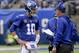 FILE - In this Oct. 28, 2018, file photo, New York Giants quarterback Eli Manning (10) talks with head coach Pat Shurmur during the second quarter of an NFL football game in East Rutherford, N.J. When things go sour, an NFL team's fan base often points to two people: the guy calling plays on the sideline, and the man behind center trying to execute them. (AP Photo/Bill Kostroun, File)