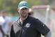Miami Dolphins head coach Adam Gase walks on the field at the NFL football team's training camp, Thursday, July 26, 2018, in Davie, Fla. (AP Photo/Lynne Sladky)