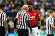 NEWCASTLE UPON TYNE, ENGLAND - JANUARY 02: Paul Pogba of Manchester United talks with Jonjo Shelvey of Newcastle United after a challenge during the Premier League match between Newcastle United and Manchester United at St. James Park on January 2, 2019 in Newcastle upon Tyne, United Kingdom. (Photo by Chris Brunskill/Fantasista/Getty Images)