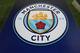 MANCHESTER, ENGLAND - NOVEMBER 07: The Manchester City badge on a board during the Group F match of the UEFA Champions League between Manchester City and FC Shakhtar Donetsk at Etihad Stadium on November 7, 2018 in Manchester, United Kingdom. (Photo by James Williamson - AMA/Getty Images)