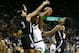 Connecticut guard/forward Megan Walker (3) defends Baylor center Kalani Brown (center) as Christyn Williams, right, looks on during the first half of an NCAA college basketball game on Thursday, Jan. 3, 2019, in Waco, Texas. (AP Photo/Ray Carlin)