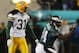 Philadelphia Eagles' Freddie Mitchell pumps his fist after catching a fourth down pass for 28 yards late in the fourth quarter against the Green Bay Packers during their NFC playoff game Sunday, Jan. 11, 2004, in Philadelphia. The Eagles won 20-17 in overtime. Packers' Al Harris is at left. (AP Photo/Miles Kennedy)