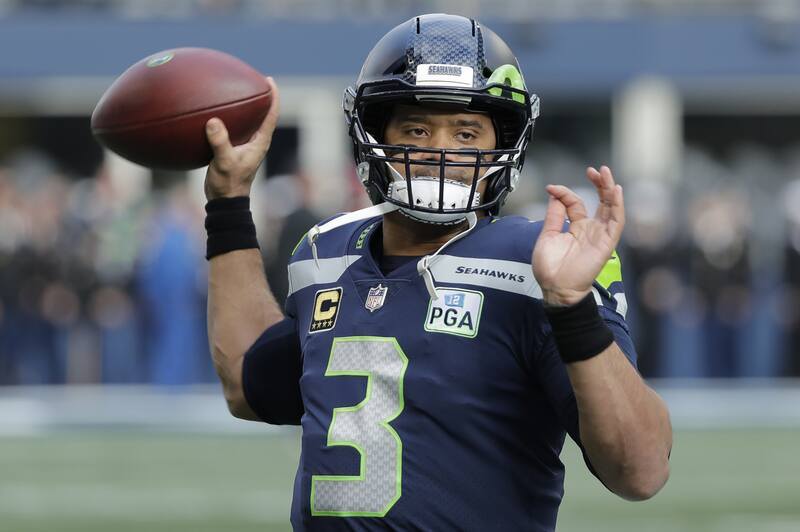 Seattle Seahawks quarterback Russell Wilson warms up before an NFL football game against the Arizona Cardinals, Sunday, Dec. 30, 2018, in Seattle. (AP Photo/Ted S. Warren)