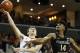 Virginia guard Kyle Guy (5) is fouled as he goes up for a shot against Florida State guard Terance Mann (14) during the first half of an NCAA college basketball game in Charlottesville, Va., Saturday, Jan. 5, 2019. (AP Photo/Steve Helber)