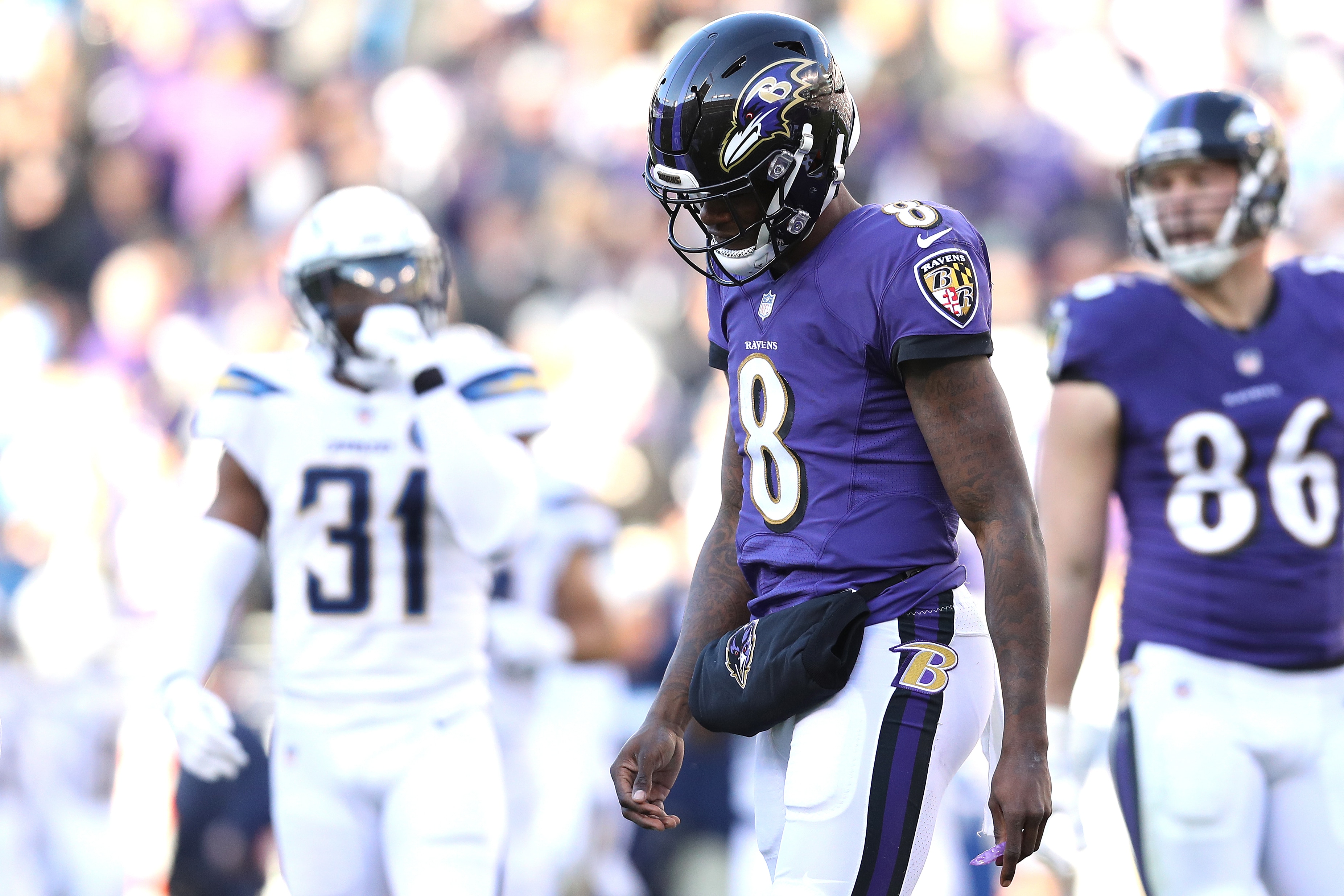 BALTIMORE, MARYLAND - JANUARY 06: Lamar Jackson #8 of the Baltimore Ravens reacts after a play against the Los Angeles Chargers during the third quarter in the AFC Wild Card Playoff game at M&T Bank Stadium on January 06, 2019 in Baltimore, Maryland. (Photo by Patrick Smith/Getty Images)