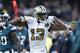NEW ORLEANS, LA - NOVEMBER 18: Michael Thomas #13 of the New Orleans Saints flexes his muscles after a big catch during a game against the Philadelphia Eagles at Mercedes-Benz Superdome on November 18, 2018 in New Orleans, Louisiana. The Saints defeated the Eagles 48-7. (Photo by Wesley Hitt/Getty Images)