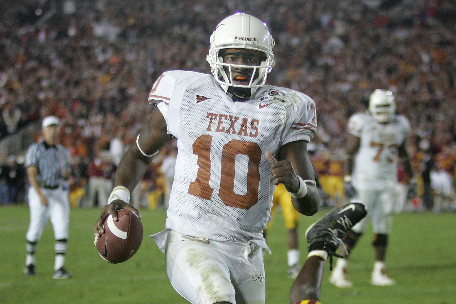 FILE - In this Jan. 4, 2006, file photo, Texas quarterback Vince Young rushes for the game-winning touchdown against Southern California during the Rose Bowl college football game in Pasadena, Calif. When Texas and Southern California last met on the football field, the Longhorns and Trojans put on a show many still call the greatest game in college football history. Texas (1-1) and No. 4 USC (2-0) meet again on Saturday night, Sept. 16, 2017. (AP Photo/Paul Sakuma, File)