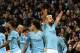 Manchester City's Argentinian striker Sergio Aguero (R) celebrates with teammates after scoring the opening goal of the English Premier League football match between Manchester City and Liverpool at the Etihad Stadium in Manchester, north west England, on January 3, 2019. (Photo by Paul ELLIS / AFP) / RESTRICTED TO EDITORIAL USE. No use with unauthorized audio, video, data, fixture lists, club/league logos or 'live' services. Online in-match use limited to 120 images. An additional 40 images may be used in extra time. No video emulation. Social media in-match use limited to 120 images. An additional 40 images may be used in extra time. No use in betting publications, games or single club/league/player publications. / (Photo credit should read PAUL ELLIS/AFP/Getty Images)