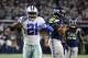 Dallas Cowboys running back Ezekiel Elliott (21) celebrates running the ball for a first down in front of Seattle Seahawks linebacker K.J. Wright (50) during an NFC wild-card NFL football game in Arlington, Texas, Saturday, Jan. 5, 2019.(AP Photo/Ron Jenkins)
