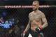 FILE - In this Saturday, Sept. 10, 2016 file photo, CM Punk stands in his corner before a welterweight bout at UFC 203 in Cleveland. CM Punk won the fight of his life this week when he was cleared by a jury of defamation and invasion of privacy in a lawsuit brought by a wrestling doctor. But he still has a big one ahead when he fights at UFC 225 in Chicago. (AP Photo/David Dermer, File)