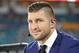 TV commentator Tim Tebow waits on the field, before the Orange Bowl NCAA college football game between Alabama and Oklahoma , Saturday, Dec. 29, 2018, in Miami Gardens, Fla. (AP Photo/Wilfredo Lee)