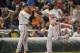Baltimore Orioles' Manny Machado is greeted by third base coach Bobby Dickerson (11) after his home run during an interleague baseball game against the Washington Nationals, Wednesday, May 10, 2017, in Washington. The Nationals won 7-6. (AP Photo/Nick Wass)