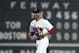 Boston Red Sox's Mookie Betts comes in past the scoreboard after the Red Sox defeated the Toronto Blue Jays during a baseball game in Boston, Thursday, July 12, 2018. (AP Photo/Michael Dwyer)