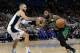 Boston Celtics' Kyrie Irving, right , drives around Orlando Magic's Evan Fournier during the second half of an NBA basketball game, Saturday, Jan. 12, 2019, in Orlando, Fla. (AP Photo/John Raoux)