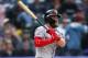 Washington Nationals' Bryce Harper follows the flight of his double off Colorado Rockies relief pitcher Chris Rusin in the ninth inning of a baseball game Sunday, Sept. 30, 2018, in Denver. The Rockies won 12-0. (AP Photo/David Zalubowski)
