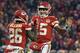 Kansas City Chiefs quarterback Patrick Mahomes (15) celebrates a touchdown with running back Damien Williams (26) during the first half of an NFL divisional football playoff game against the Indianapolis Colts in Kansas City, Mo., Saturday, Jan. 12, 2019. (AP Photo/Ed Zurga)