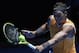 Spain's Rafael Nadal makes a backhand return in his first round match against Australia's James Duckworth at the Australian Open tennis championships in Melbourne, Australia, Monday, Jan. 14, 2019. (AP Photo/Aaron Favila)