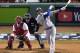 Los Angeles Dodgers' Manny Machado hits a sacrifice fly to drive in Max Muncy during the seventh inning of Game 1 of the World Series baseball game against the Boston Red Sox Tuesday, Oct. 23, 2018, in Boston. (AP Photo/Elise Amendola)
