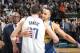 DALLAS, TX - JANUARY 13: Luka Doncic #77 of the Dallas Mavericks and Stephen Curry #30 of the Golden State Warriors hug after a game on January 13, 2019 at the American Airlines Center in Dallas, Texas. NOTE TO USER: User expressly acknowledges and agrees that, by downloading and or using this photograph, User is consenting to the terms and conditions of the Getty Images License Agreement. Mandatory Copyright Notice: Copyright 2019 NBAE (Photo by Glenn James/NBAE via Getty Images)