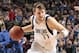 DALLAS, TX - JANUARY 13: Luka Doncic #77 of the Dallas Mavericks drives to the basket against the Golden State Warriors on January 13, 2019 at the American Airlines Center in Dallas, Texas. NOTE TO USER: User expressly acknowledges and agrees that, by downloading and or using this photograph, User is consenting to the terms and conditions of the Getty Images License Agreement. Mandatory Copyright Notice: Copyright 2019 NBAE (Photo by Glenn James/NBAE via Getty Images)