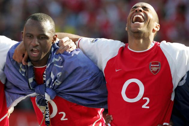 LONDON, UNITED KINGDOM:  Arsenal's Patrick Vieira (L) and Thierry Henry celebrate after winning the Premiership title and defeating Leicsester City 15 May, 2004 at Highbury in London. Arsenal defeated Leicester City 2-1 and finish the season undefeated.   AFP PHOTO/JIM WATSON  (Photo credit should read JIM WATSON/AFP/Getty Images)