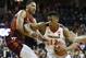 Virginia Tech forward Kerry Blackshear Jr. , left, tries to block Virginia guard De'Andre Hunter (12) during the first half of an NCAA college basketball game in Charlottesville, Va., Tuesday, Jan. 15, 2019. (AP Photo/Steve Helber)