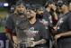 Boston Red Sox catcher Christian Vazquez holds the championship trophy after Game 5 of baseball's World Series against the Los Angeles Dodgers on Sunday, Oct. 28, 2018, in Los Angeles. The Red Sox won 5-1 to win the series 4 game to 1. (AP Photo/David J. Phillip)