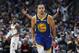 Golden State Warriors guard Stephen Curry reacts after hitting a 3-point basket against the Denver Nuggets in the second half of an NBA basketball game, Tuesday, Jan. 15, 2019, in Denver. The Warriors won 142-111. (AP Photo/David Zalubowski)