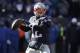 New England Patriots quarterback Tom Brady drops back to pass against the Los Angeles Chargers defensive during the first half of an NFL divisional playoff football game, Sunday, Jan. 13, 2019, in Foxborough, Mass. (AP Photo/Charles Krupa)