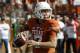 Texas quarterback Shane Buechele looks to throw during the first half of an NCAA college football game against West Virginia, Saturday, Nov. 12, 2016, in Austin, Texas. (AP Photo/Michael Thomas)