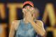 MELBOURNE, AUSTRALIA - JANUARY 18: Maria Sharapova of Russia celebrates winning match point in her third round match against Caroline Wozniacki of Denmark during day five of the 2019 Australian Open at Melbourne Park on January 18, 2019 in Melbourne, Australia. (Photo by Fred Lee/Getty Images)